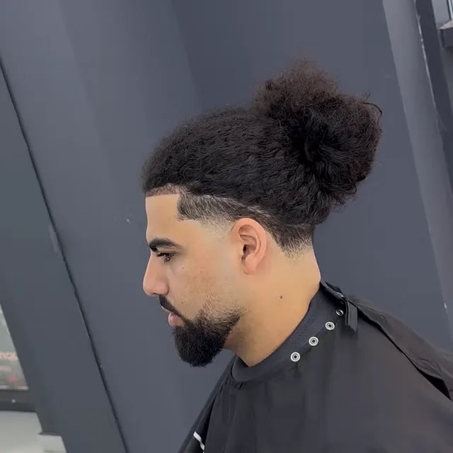 Man bun, sharp line-up and sculpted beard by Abde